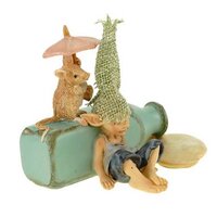 Pixie sleeping on a milk Bottle